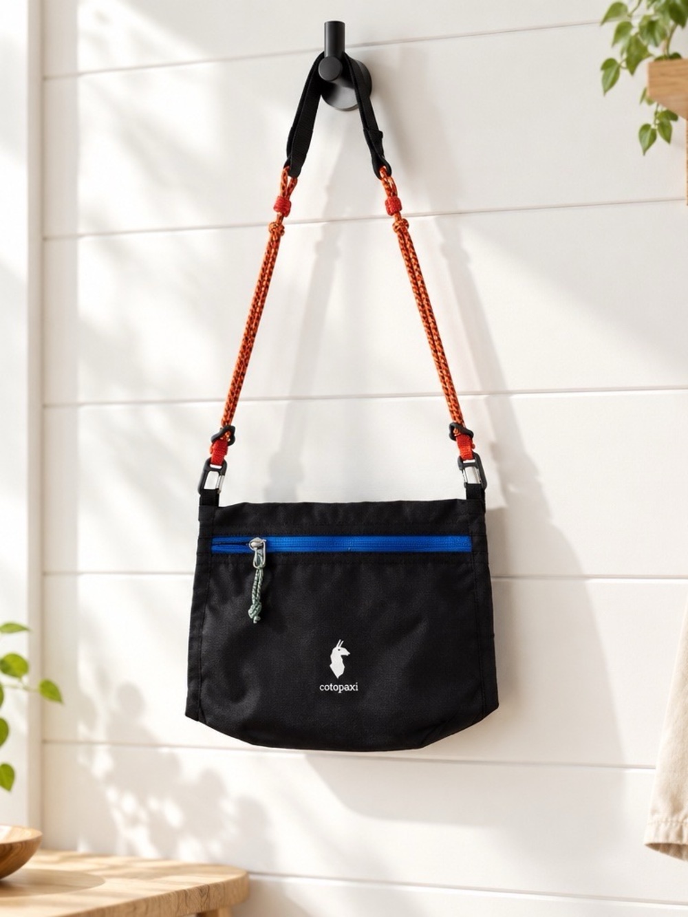 Cotopaxi Black Lista 2L Crissbody Bag with Blue Zip and Orange Strap